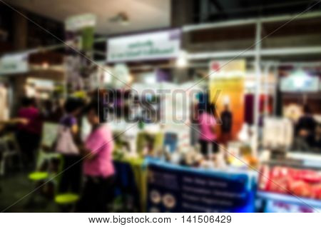 The trade fair booth selling cheap goods from the manufacturer. A game show and giveaways. Abstract blur