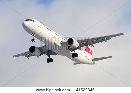SAINT PETERSBURG, RUSSIA - FEBRUARY 17, 2016: The Airbus A321-111 (HB-IOF) Swiss International Airlines in a cloudy sky