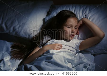 Cute sleeping girl in bed