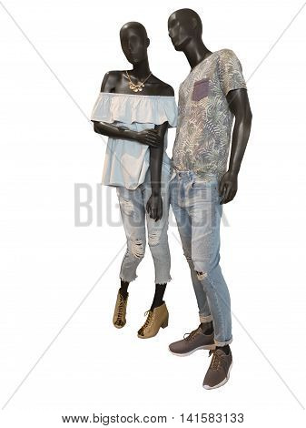 Two mannequins male and female dressed in casual summer clothes. Isolated on white background. No brand names or copyright objects.