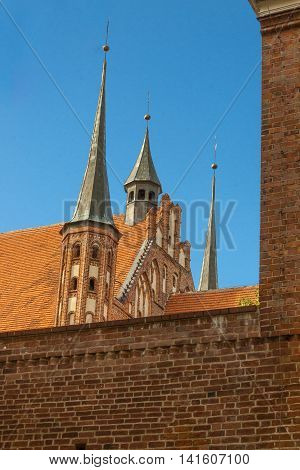 Frombork Poland - old brick wall and Cathedral.