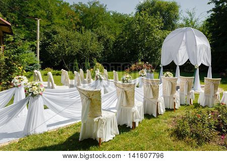 Wedding ceremony decorations in the park at sunny day