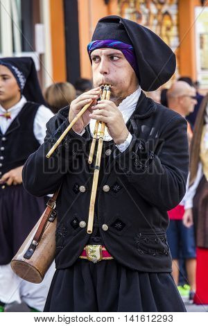 SELARGIUS, ITALY - September 13, 2015: Former marriage Selargino - Sardinia - portrait of a man in Sardinian costumes while playing launeddas