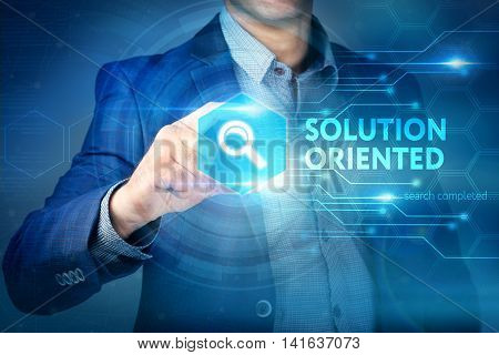 Business, Internet, Technology Concept.businessman Chooses Solution Oriented Button On A Touch Scree