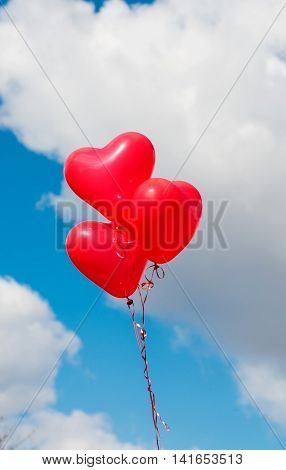 Valentine heart balloon against blue sky background