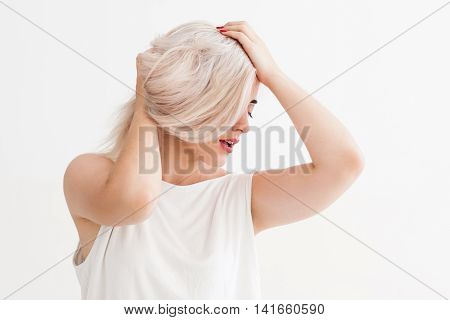 Blonde girl with bad hair. Bad condition of dyed hair, health and beauty concept