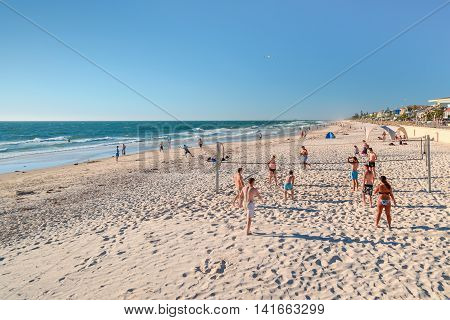 Adelaide Australia - February 7 2016: People playing volleyball at Henley Beach on a warm sunny day.