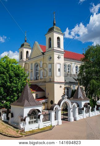 Peter and Paul Cathedral in the street Nemiga against the blue sky Belarus
