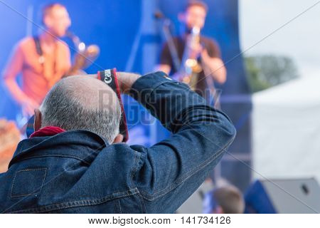 Photographer During A Free Concert
