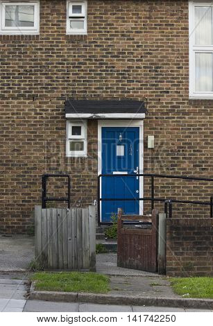 LONDON, UNITED KINGDOM - SEPTEMBER 12 2015: Close up of a traditional british house with blue door done in brick