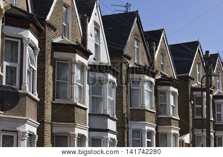 LONDON, UNITED KINGDOM - SEPTEMBER 12 2015: Traditional English terraced house in a row in Woolwich Arsenal London district