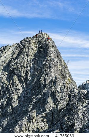 High Tatras Slovakia - June 23 2016: Teams of mountaineers on the ridge leading to the prominent peak in the Tatras.