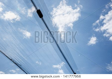 Anti-hail protective netting for agricultural and other use for crop protection. Industrial and agricultural damage control with preventive measures. Food production and industry concept.