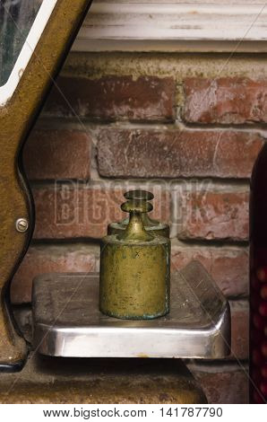 details of two weigths on a balance