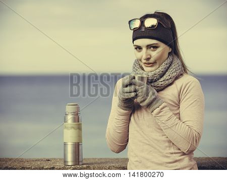 Fit Woman In Cold Day Warming Up Drink Tea