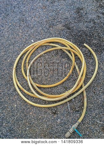 White rubber tube on the rock background