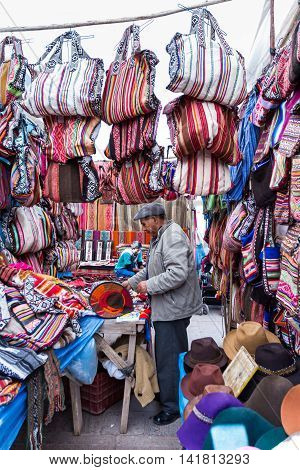 Man Selling Peruvian Bags And Other Souvenirs