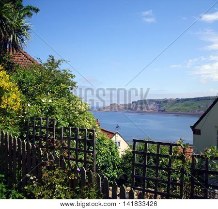 View of Runswick Bay through the Rooftops of the town