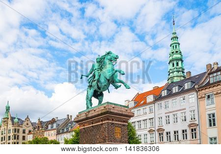 Copenhagen Denmark - July 20 2015: The traditional houses of Hojbro square with the equestrian statue of Bishop Absalon