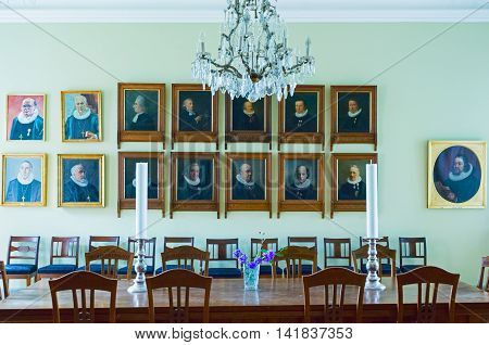 Odense Denmark - July 21 2015: Portraits of the ancient priests in the sacristy the St. Canute's Cathedral