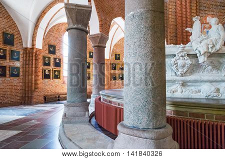 Roskilde Denmark - July 23 2015: The chancel with the Royal tombs and the ancient priest portraits in the medieval Cathedral
