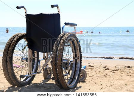Wheelchair Aluminum On The Sand Of The Beach