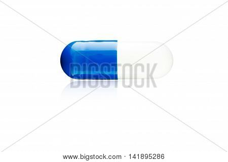 Antibiotics Capsules Blue drug reflections on a white background.