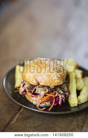 pulled pork and coleslaw burger with thick fries
