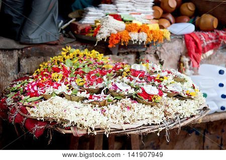 Puja flowers for aarti ritual. Puja flowers offering for the Ganges river in Varanasi India.
