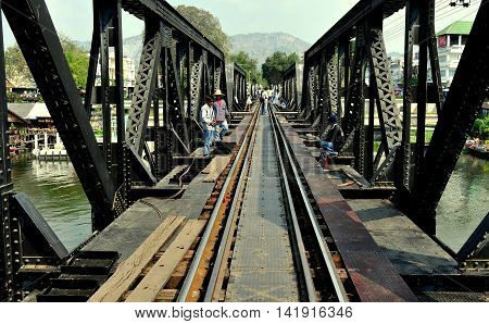 Kanchanaburi Thailand - December 24 2010: View along the tracks of the legendary railway Bridge on the River Kwai immortalised in the classic 1957 David Lean movie