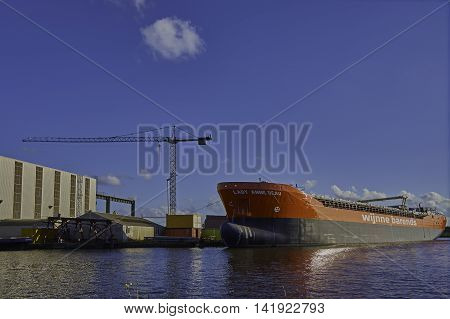 WATERHUIZEN, THE NETHERLANDS - AUGUST 9, 2016: Outfitting of Lady Anne Beau multi purpose vessel at Groningen Shipyard. Length of ship is 88 meter en deadweight is 3,700 ton.