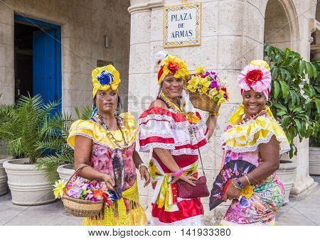 HAVANA CUBA - JULY 18 : Cuban women with traditional clothing in old Havana street on July 18 2016. The historic center of Havana is UNESCO World Heritage Site since 1982.