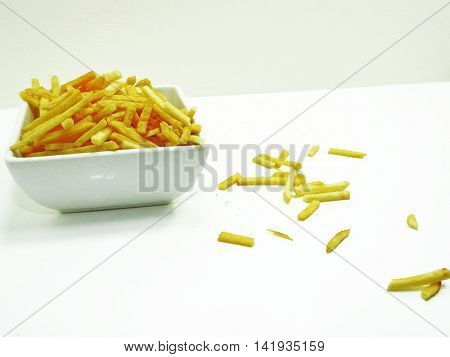 French fries in white plate isolated on white background.