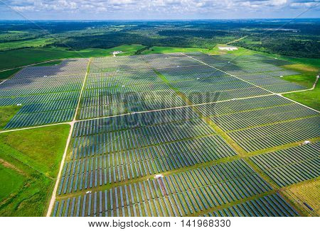 Aerial View Solar Panel Power Plant creating green renewable sustainable energy near Austin , Texas during Summer time 34 Megawatts of Energy directly from the sun