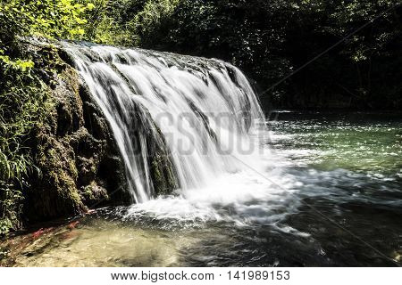 small waterfalls and small lake details closeup