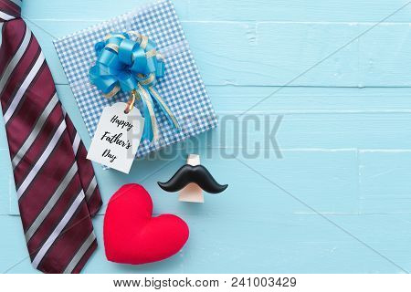 Happy Fathers Day Concept. Red Tie, Glasses, Mustache, Gift Box With Happy Father's Day Text And Han