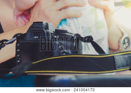 Father Embracing And Kissing His Sweet Adorable Baby. Selective Focus On Camera.