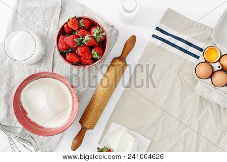 Top View Set Raw Ingredients For Cooking Strawberry Pie Or Cake On White Background With Copy Space 