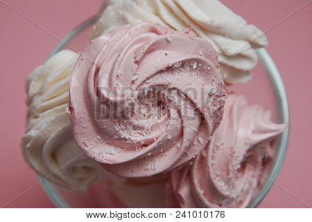 Close Up Pink Homemade Strawberry Marshmallows Or Zephyr. Pink Desert Over Pink Background