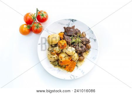 Beef meat stewed with potatoes-Traditional French cuisine Beef Bourguignon potatoes carrots in persillade