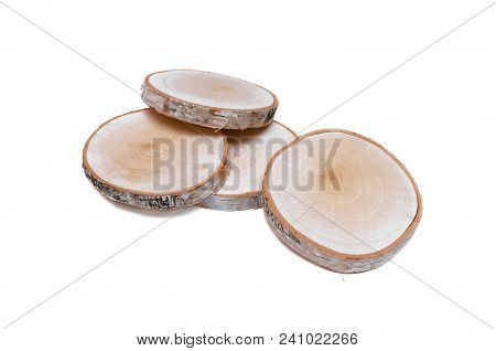 Sawn Birch Wooden Logs On Round Discs Isolated On White Background.