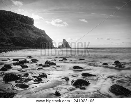 The Rest Of The Day In Rocky Bay. Evening Light On The Rocks, Boulders And Cliff Face Of Talisker Ba