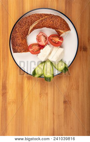 Breakfast With Feta Cheese,  Simit, Cucumber, And Cherry Tomoto  Isolated On Wooden Background Top V