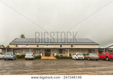 Howick, South Africa - March 22, 2018: Businesses And Vehicles At The Piggly Wiggly Shopping Centre,