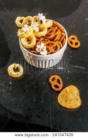 Variation Different Unhealthy Snacks Crackers, Sweet Salted Popcorn, Tortillas, Nuts, Straws, Bretse