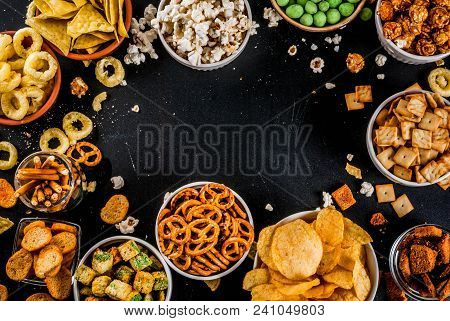 Variation Different Unhealthy Snacks Crackers, Sweet Salted Popcorn, Tortillas, Nuts, Straws, Bretse