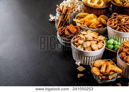 Variation Different Unhealthy Snacks Crackers, Sweet Salted Popcorn, Tortillas, Nuts, Straws, Bretse