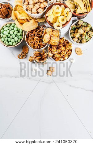 Variation Different Unhealthy Snacks Crackers, Sweet Salted Popcorn, Tortillas, Nuts, Straws, Bretse