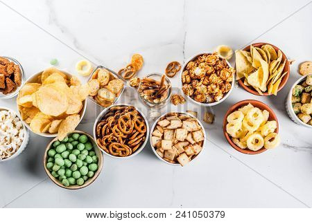 Variation Different Unhealthy Snacks Crackers, Sweet Salted Popcorn, Tortillas, Nuts, Straws, Bretse