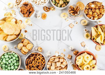 Variation Different Unhealthy Snacks Crackers, Sweet Salted Popcorn, Tortillas, Nuts, Straws, Bretse